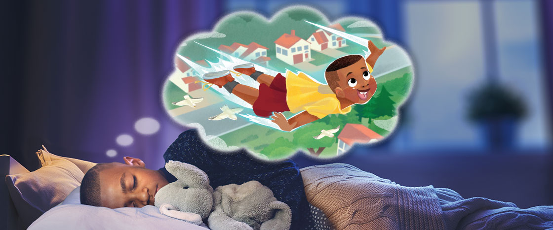 A boy asleep in bed dreaming of flying 