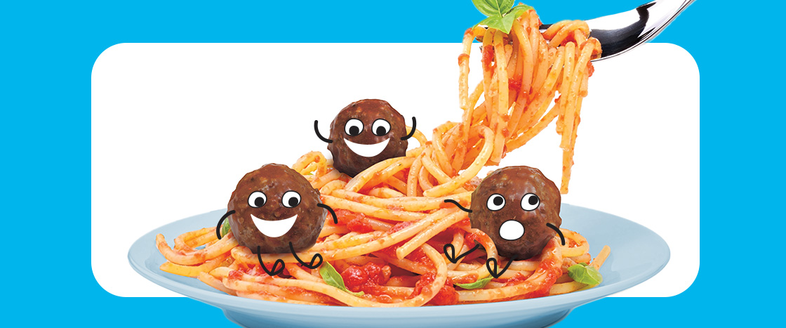 Image of a spaghetti and meatballs where the meatballs are smiling